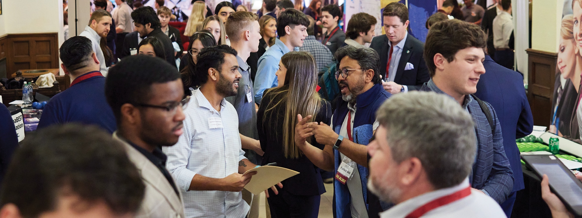 employers and students interacting at a job and internship fair