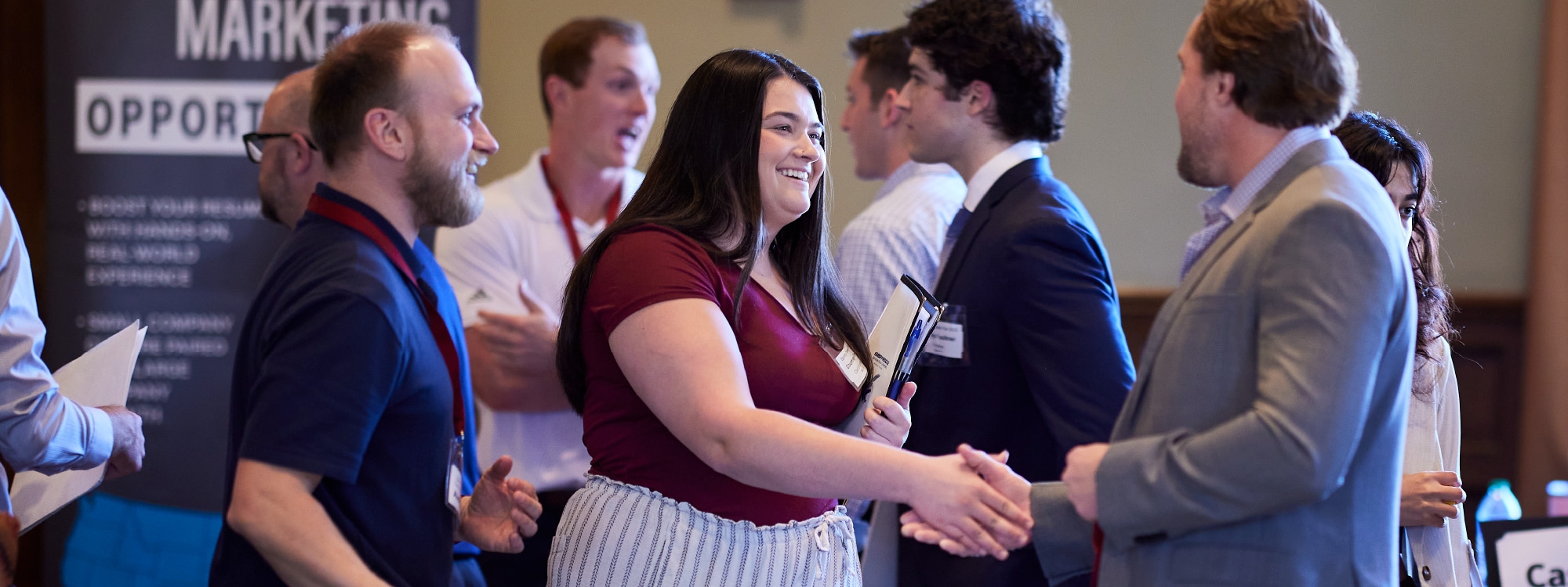 student and recruiter shaking hands