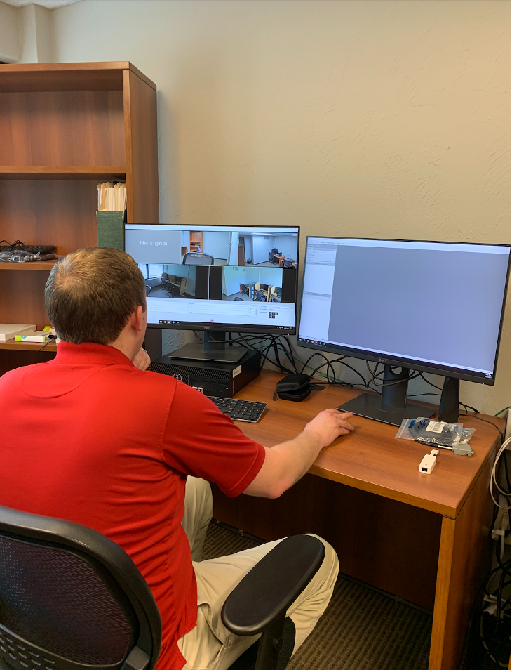 Researcher checking camera access in all observation rooms