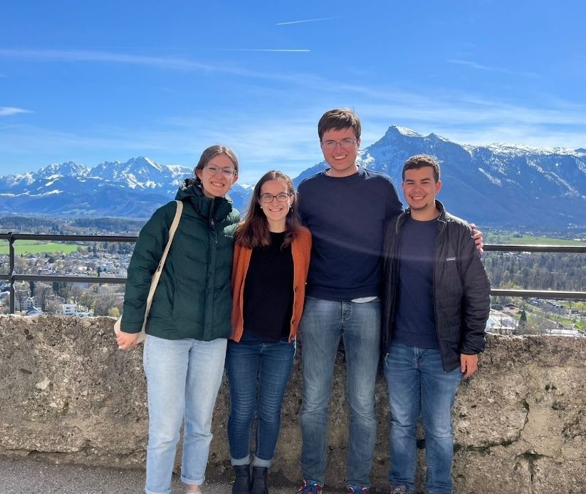 Students posing in front of mountains