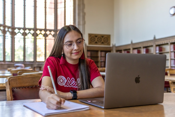 A student on the computer in the Great Reading Room.