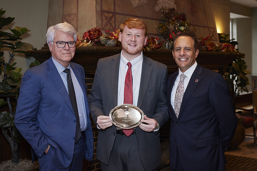 Ed Kelley, Gaylord College Dean; Jackson Conner, Gaylord Outstanding Senior; Joseph Harroz, Jr, University of Oklahoma President. All standing at Outstanding Senior Ceremony post-award presentation.