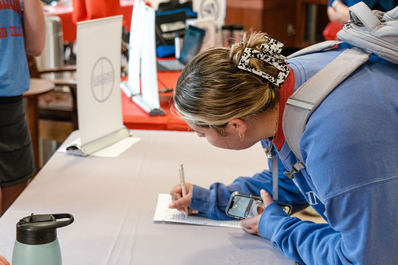 Gaylord student signs up for activities at Gaylord Involvement Fair