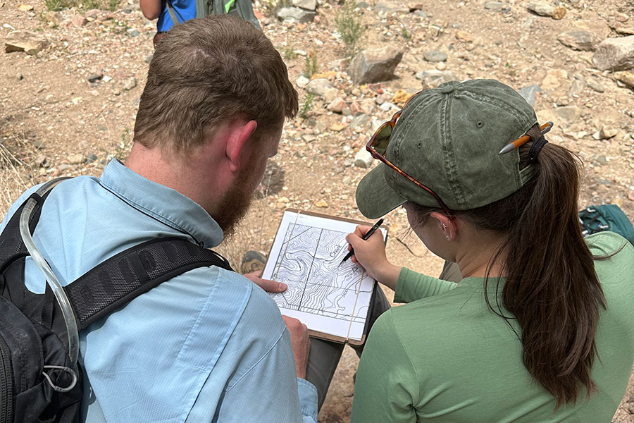 Faculty instructing students in the field.