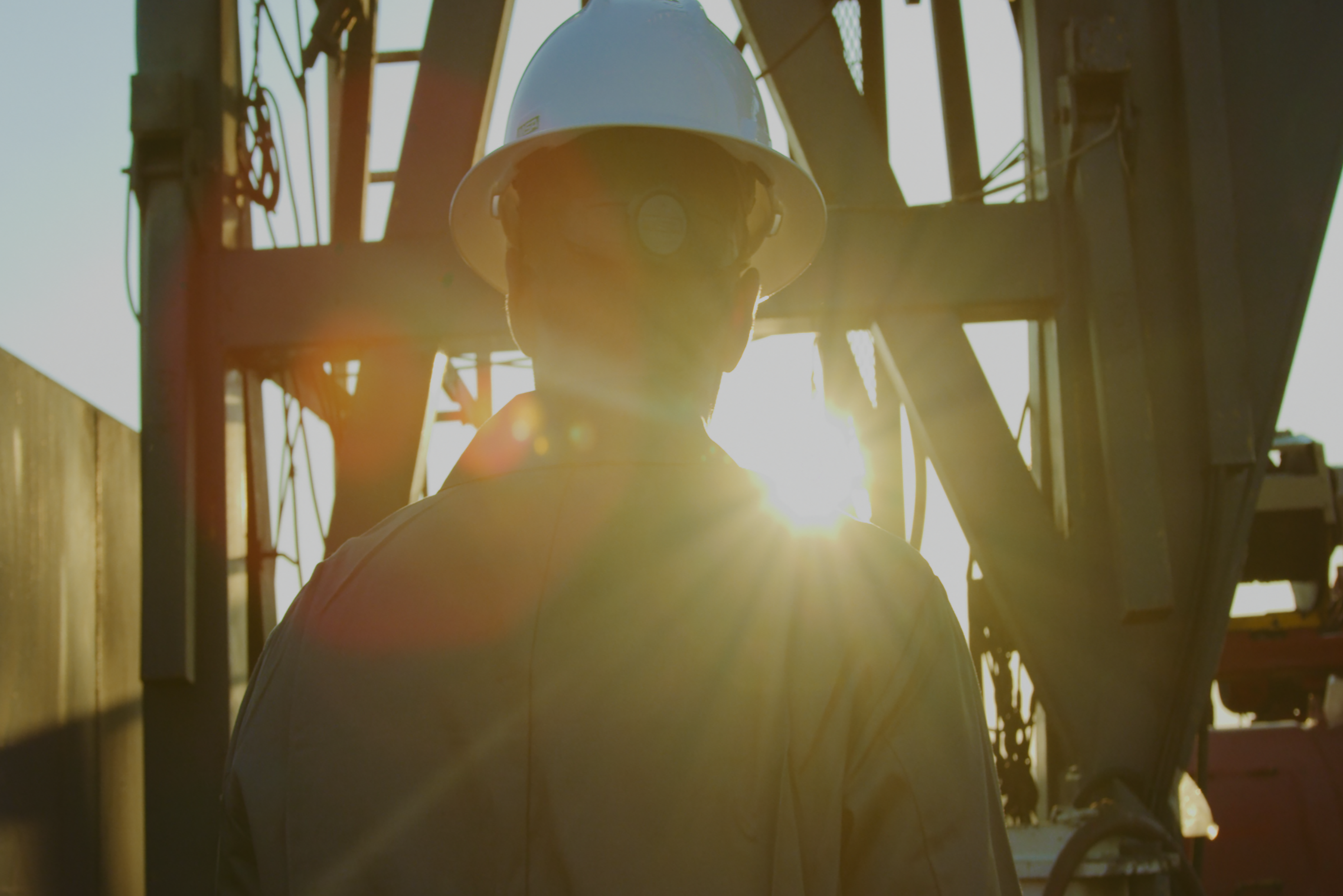 Picture of a student walking around a well site.