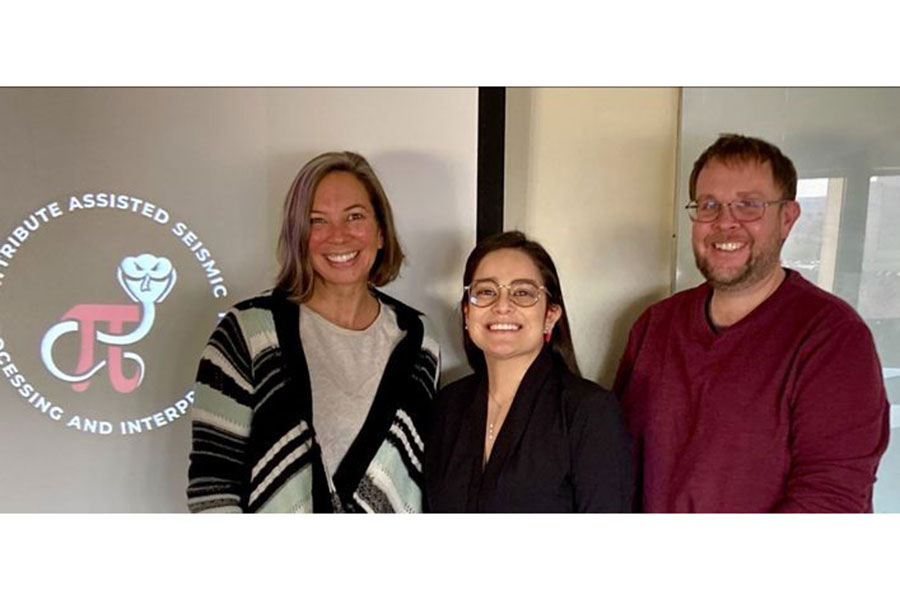 Diana, Dr C, and Dr Bedle stand in front of a screen with AASPI logo.