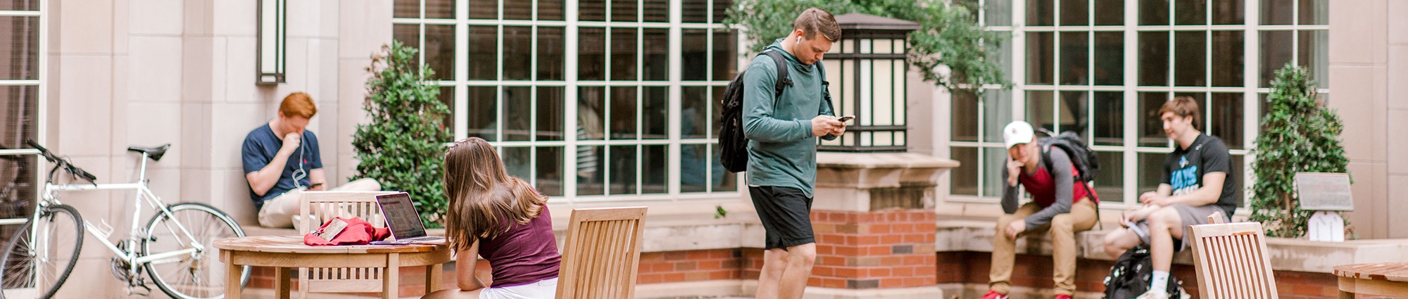 student walking through campus photo