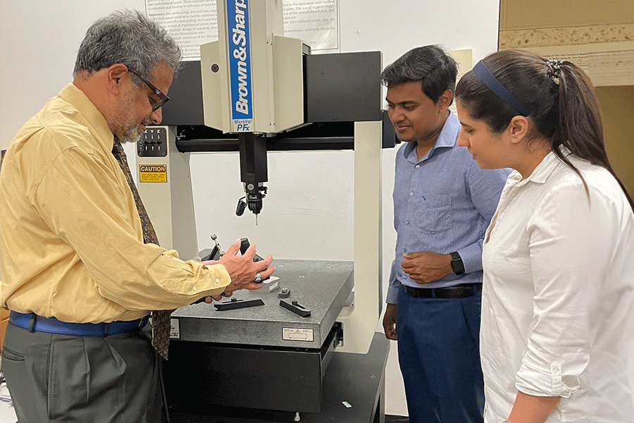 Engineering professor with two-students.