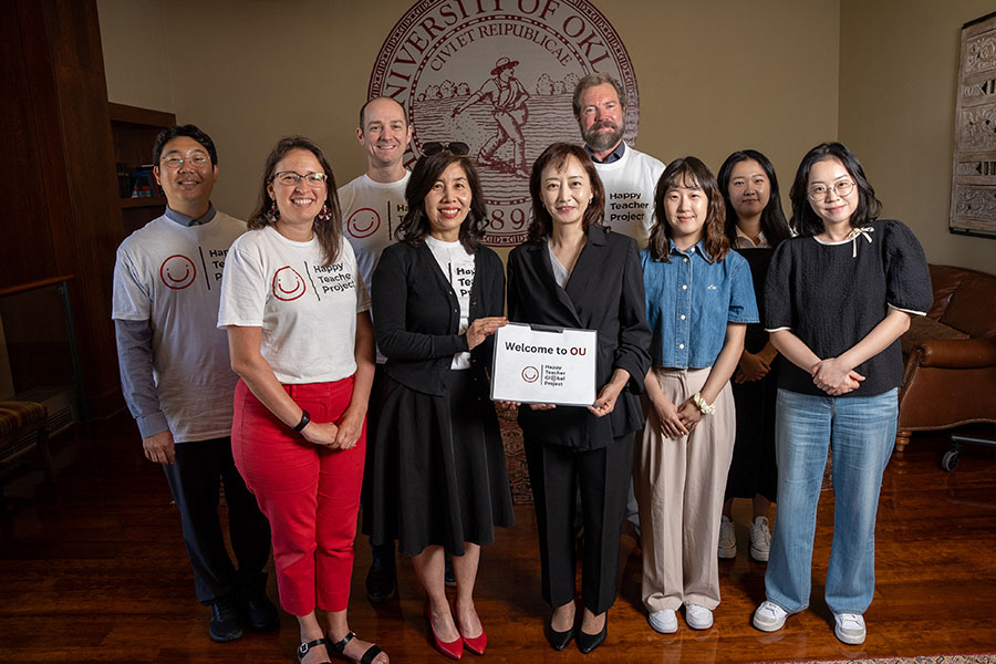 The Happy Teacher Project team and Souther Korean Happy Teacher Team standing together.