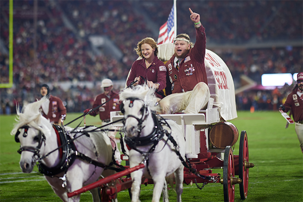 Ruf Nek and Ruf Nek Little Sis steer Sooner Schooner after an OU score during 2022 Bedlam Game