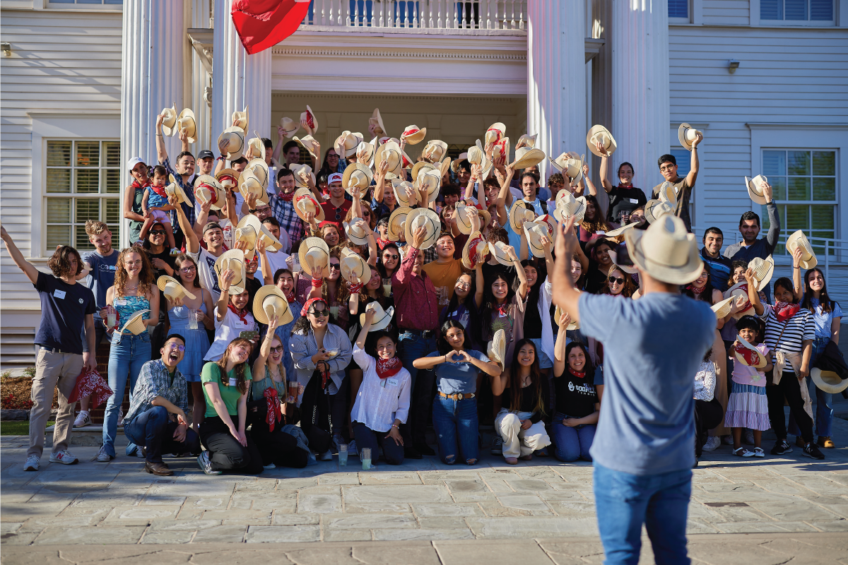 OU students, faculty, and staff in front of Boyd House during the OU Cousins BBQ