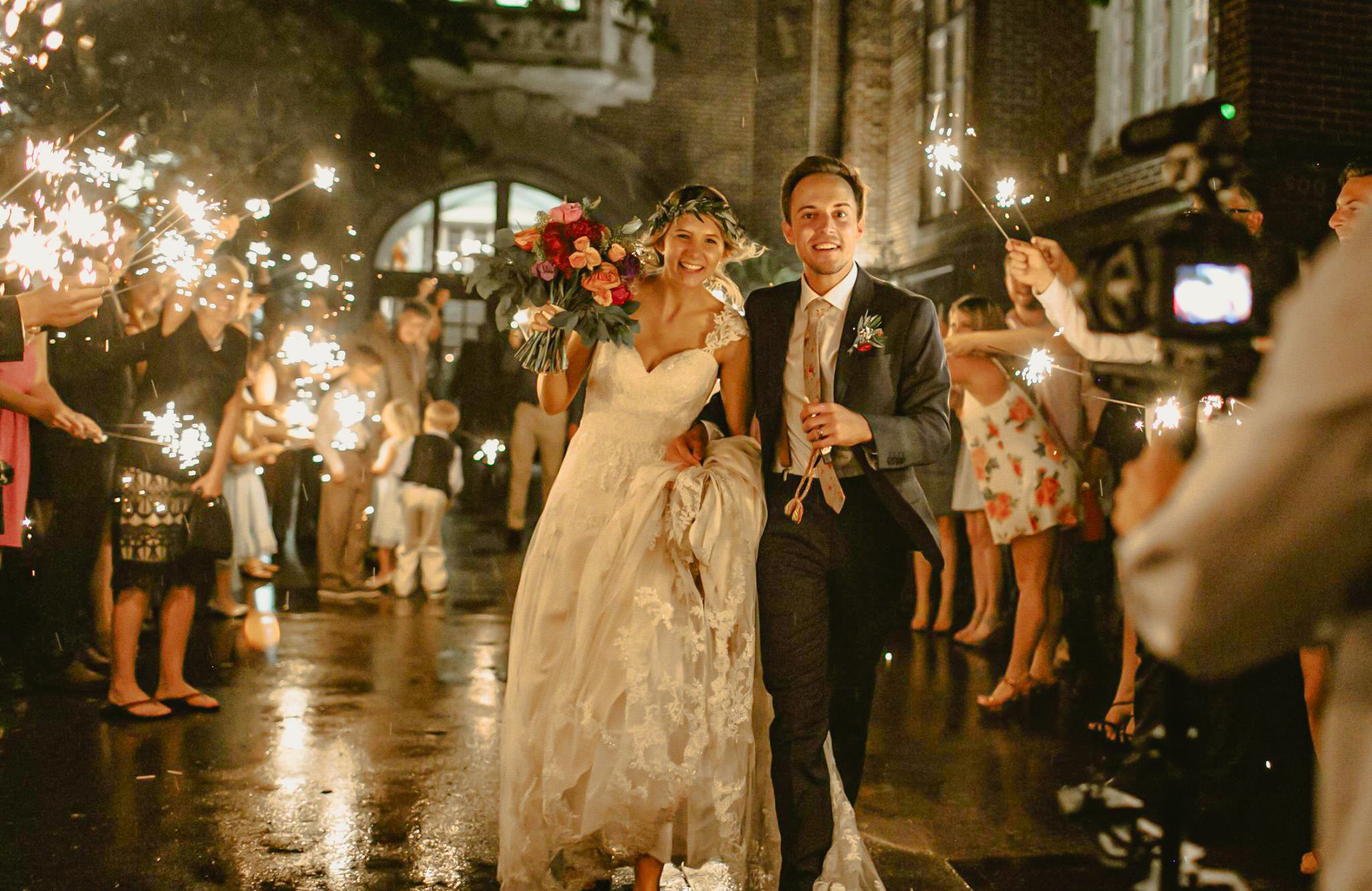 Bride and groom exiting the east entrance of the Oklahoma Memorial Union