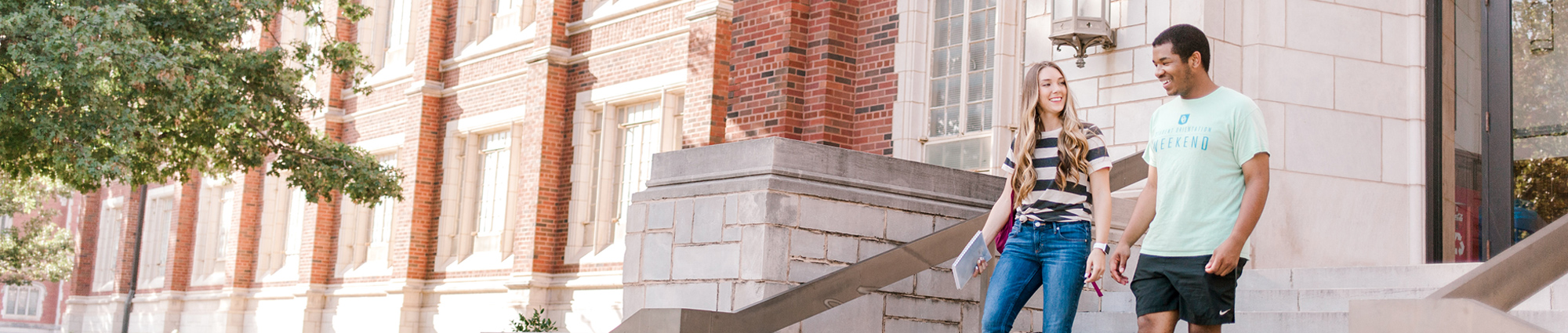 Students walking down the front steps of Price Hall