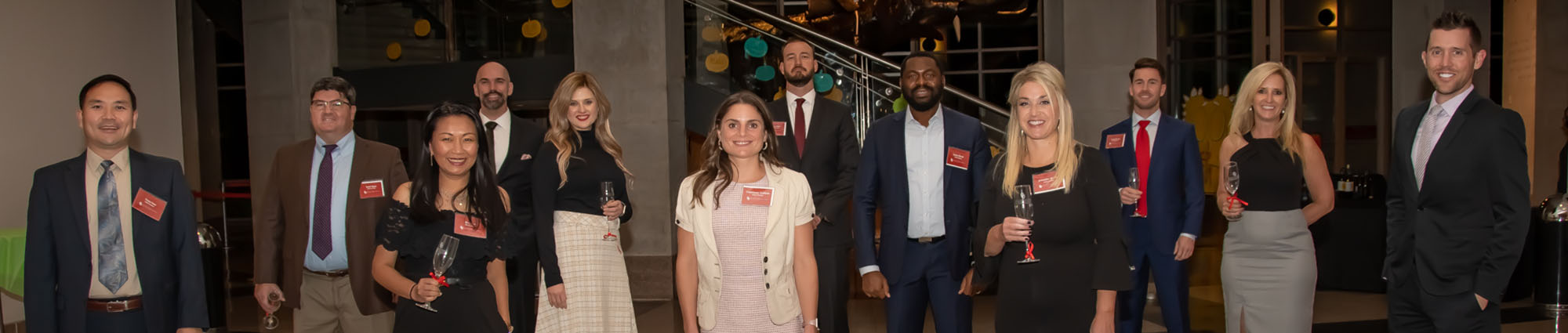 Executive MBA in Energy Class 12 poses for a photograph at the celebratory dinner at Sam Noble Museum.