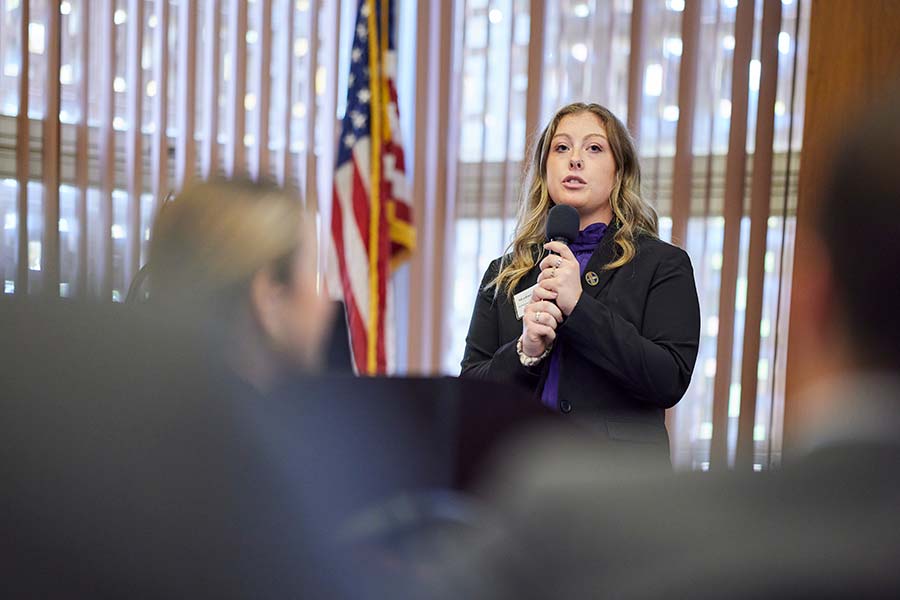 A member of the JCPenney Leadership program welcomes guests to their annual conference. 