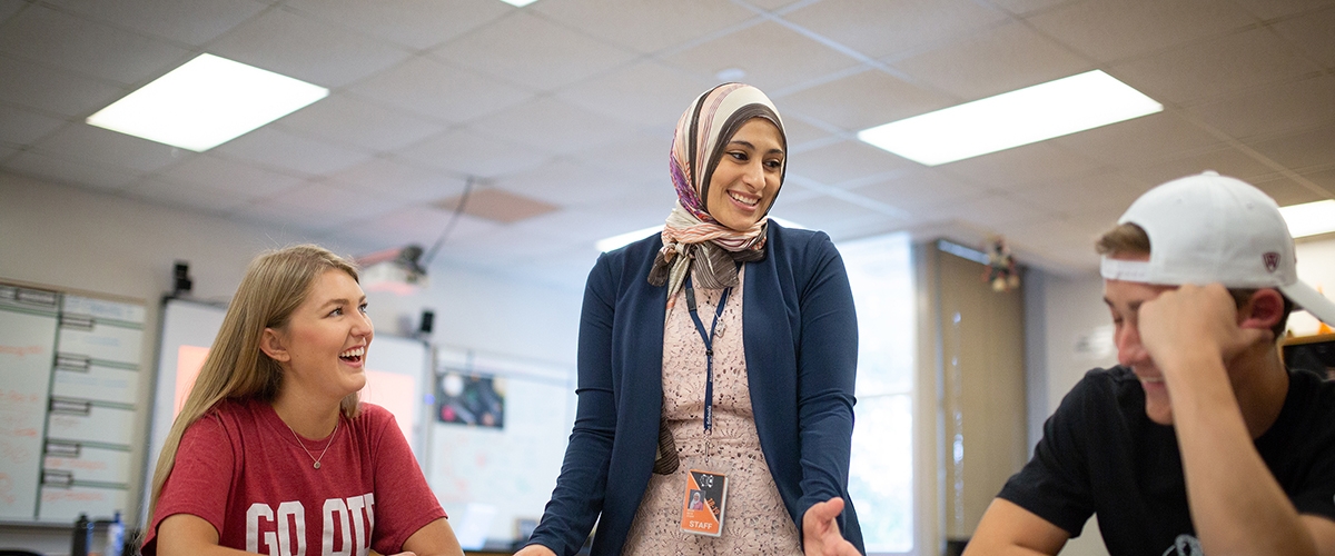 Eman Beck with students at Norman High