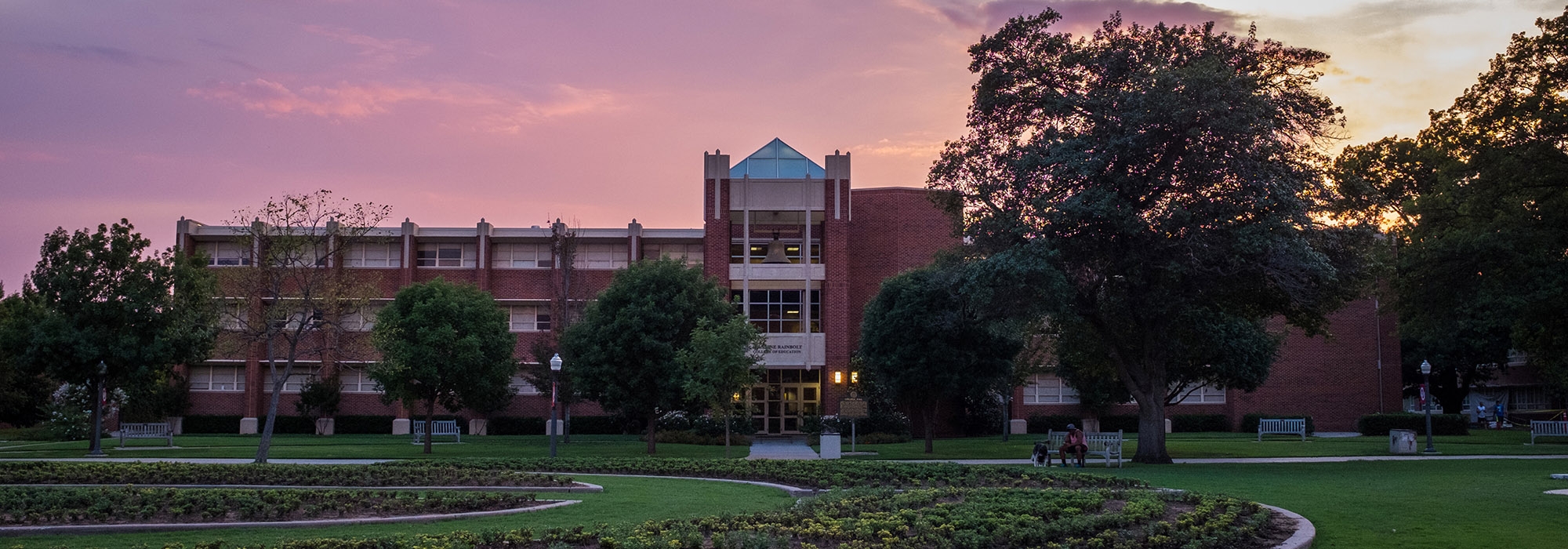 Jeannine Rainbolt College of Education at night.