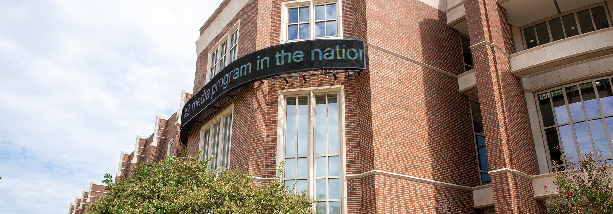 Gaylord College "#2 media program in the nation" displayed on news ticker.