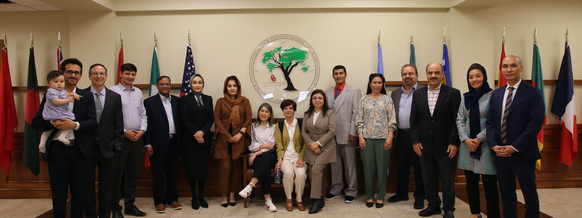 Group photo of scholars-at-risk, Dean Scott Fritzen, Mohammad and Jalal Farzaneh