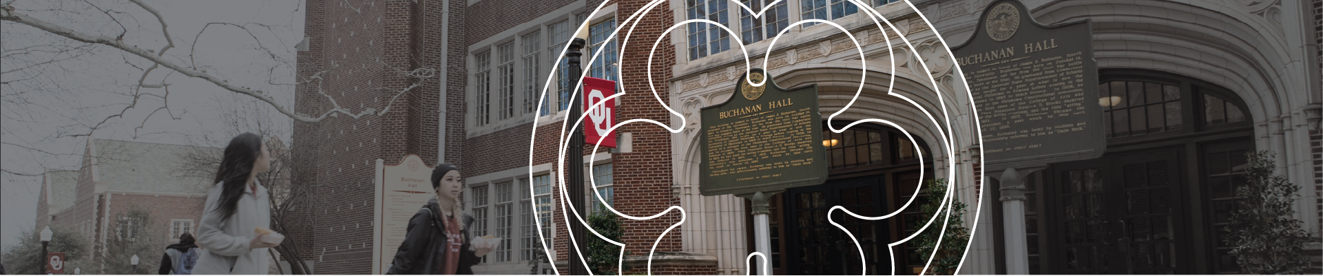 Two students walking in front of Buchanan Hall.