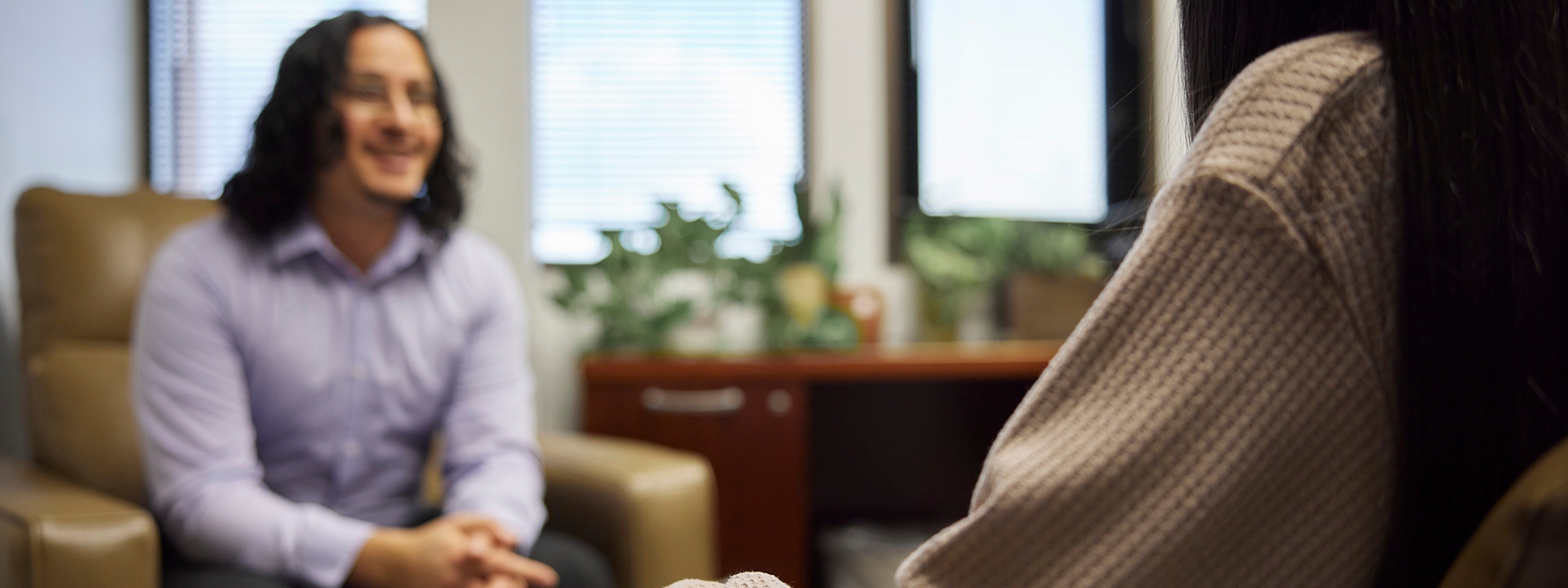 Medical professional meets with patient to discuss treatment