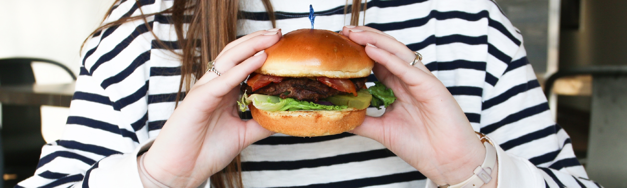 Student holding hamburger