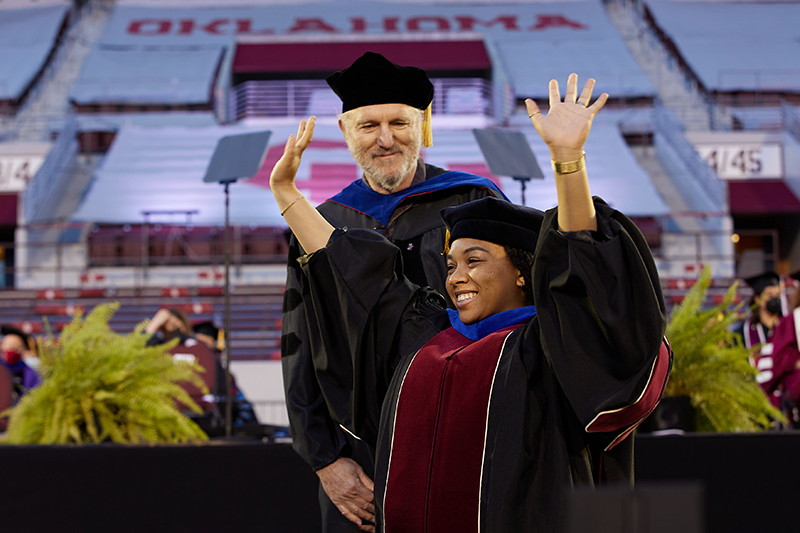 OU Student crosses the stage at graduation ceremony