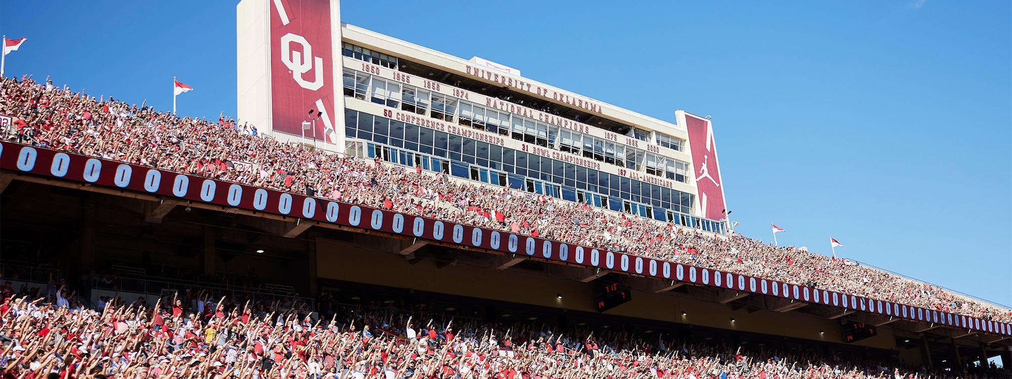 View of the upper section of the football stadium with the press box in the background.