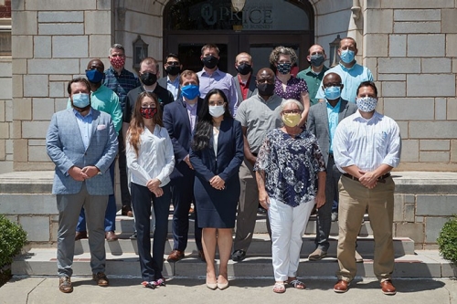 EMBA cohort 10 group photo outside of Adams Hall