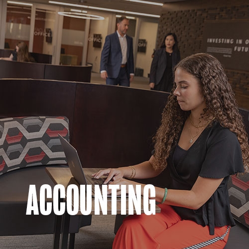 A student sitting in a study area. Several other students are in the background studying and two others are walking down the hall. Text over photo reads: Accounting