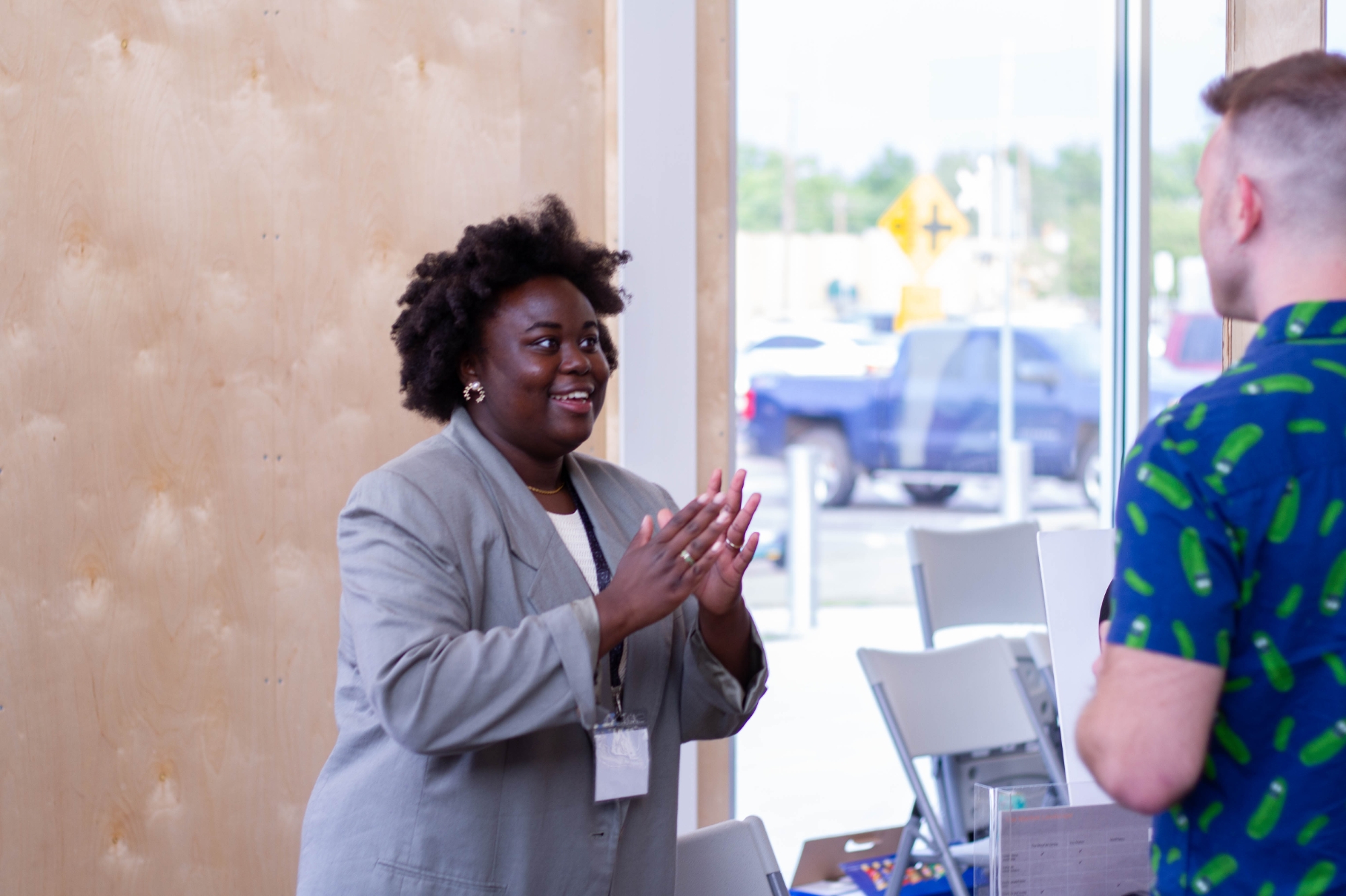 A business woman pitches her startup at Demo Day.