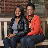 OU student with mom sitting on a bench