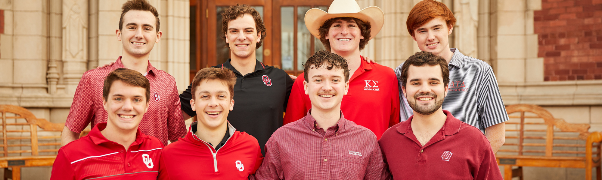 Photo of IFC Executive Team members in front of Evans Hall. 