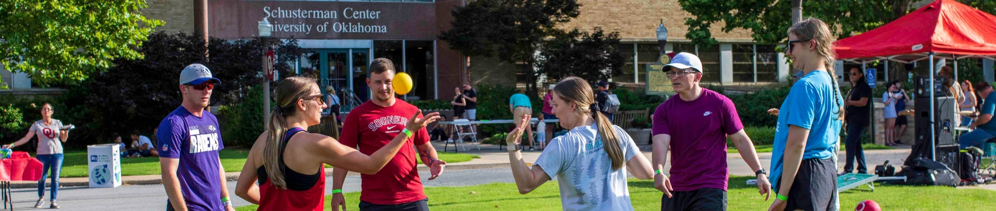 Students playing a game while enjoying barbecue and fun at OU-Tulsa Schustercue event.