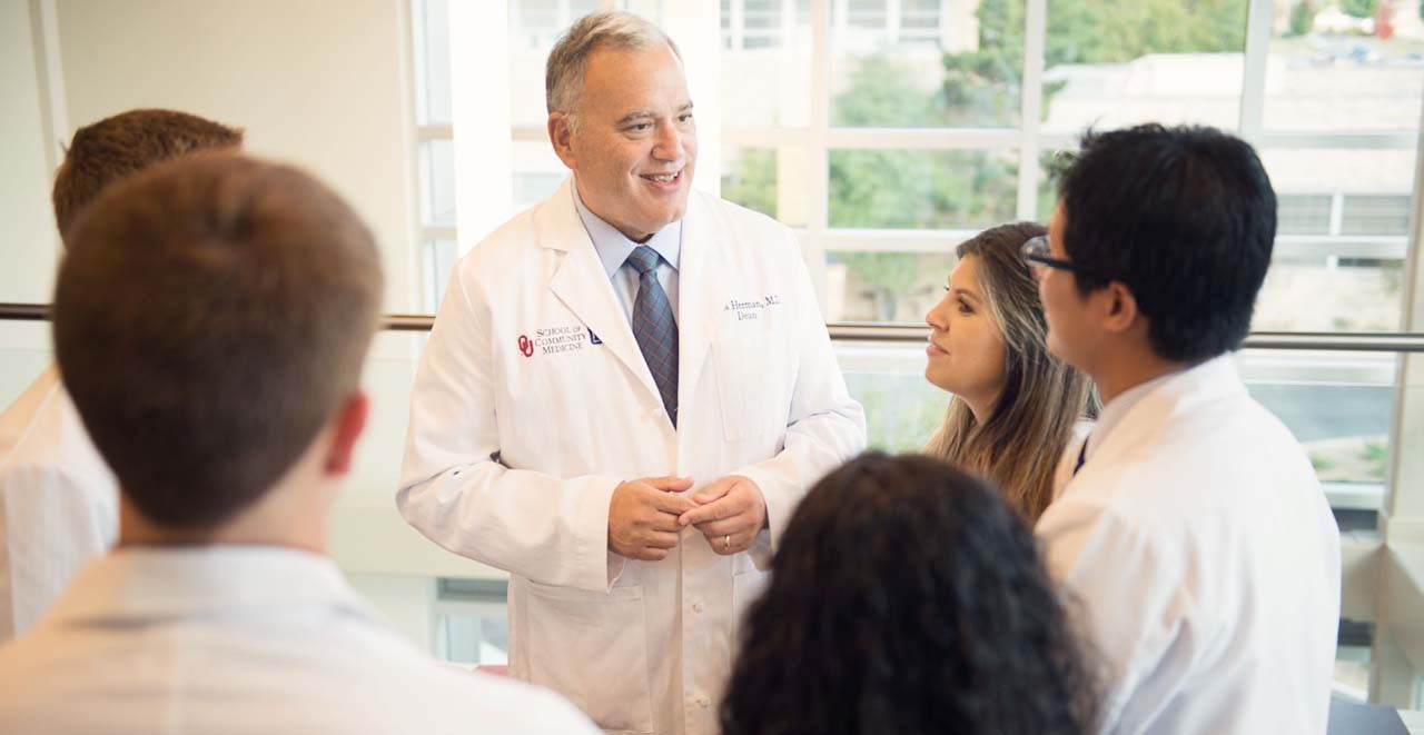 Dean Herman with students