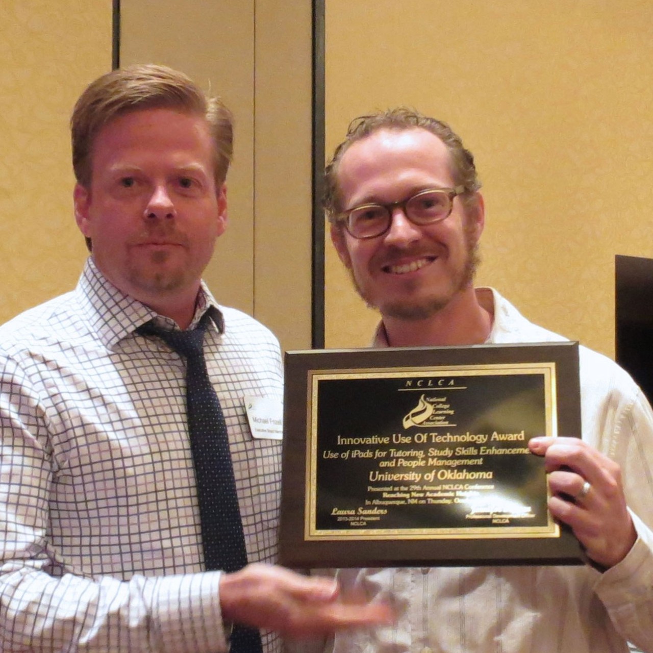 Michael Frizell presents Mark Walvoord with award