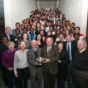 Large group posing with Davis Cup