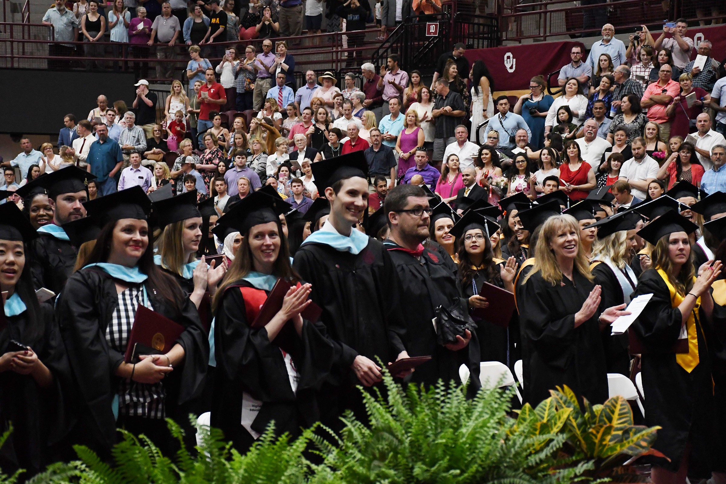 graduates entering Lloyd Noble