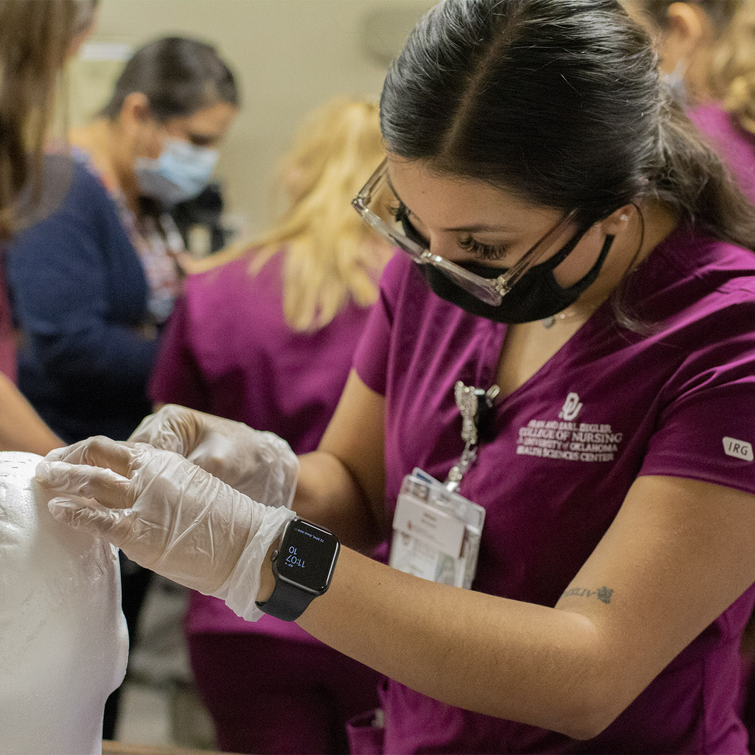 Nursing student performing intake exam