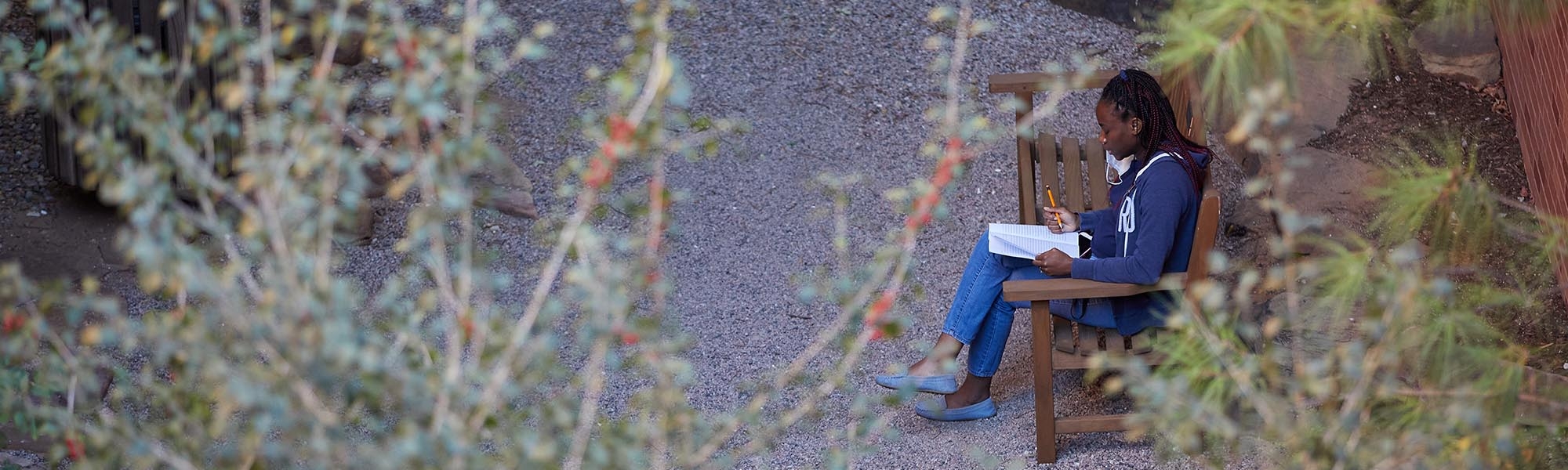 Student sitting in the Canyon Garden